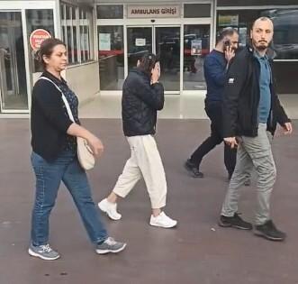 Yaşından büyük cezası olan kadın hırsız kameraları görünce yüzünü gizlemeye çalıştı